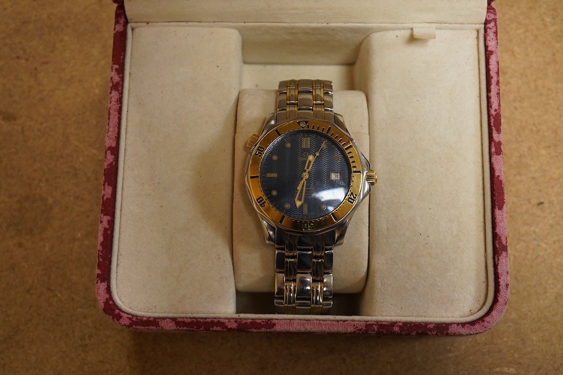 A gentleman's mid 1980's stainless steel and gold plated Omega Seamaster Professional Chronometer automatic wrist watch, with blue dial, dot numerals and date aperture, movement c.1109, case diameter 40mm, on an Omega st